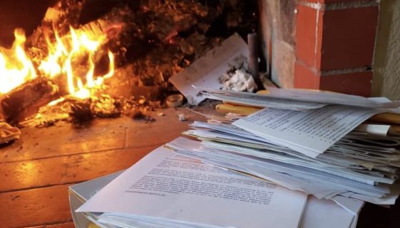 burning documents in fireplace